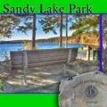 A collage of Sandy Lake Park in Bedford, Nova Scotia, featuring a wooden park bench overlooking the lake, vibrant autumn foliage, a commemorative Bedford Lions Club stone marker from 2003, and tall pine trees under a clear blue sky.