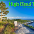 Scenic coastal view of High Head Trail at the Bill Freedman Nature Reserve near Prospect, Nova Scotia, featuring a wooden park bench on a rocky path overlooking the Atlantic Ocean, with a lone evergreen tree and rugged granite coastline under a clear blue sky.