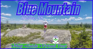 Granite barrens overlook at Blue Mountain Birch Cove Lakes Wilderness Area in Halifax, featuring a stone cairn and panoramic forest views.