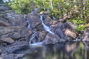 Pockwock Falls, a cascading woodland waterfall over granite rock ledges in the Pockwock Wilderness Area, Upper Hammonds Plains